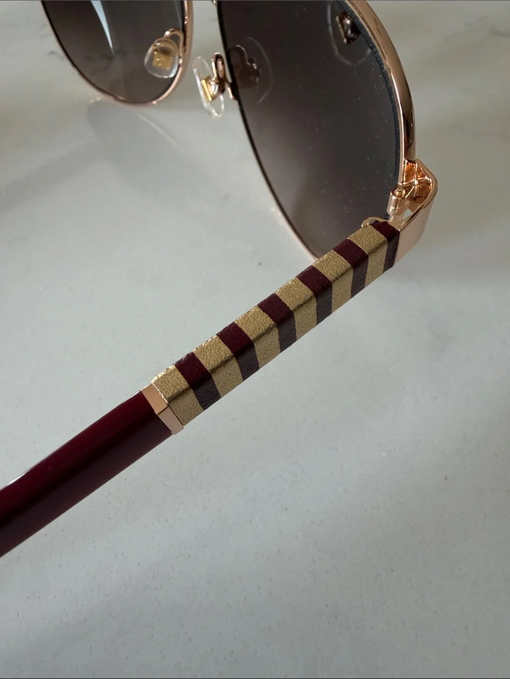 kate spade Rose Gold Frame Sunglasses with Burgundy Temples
